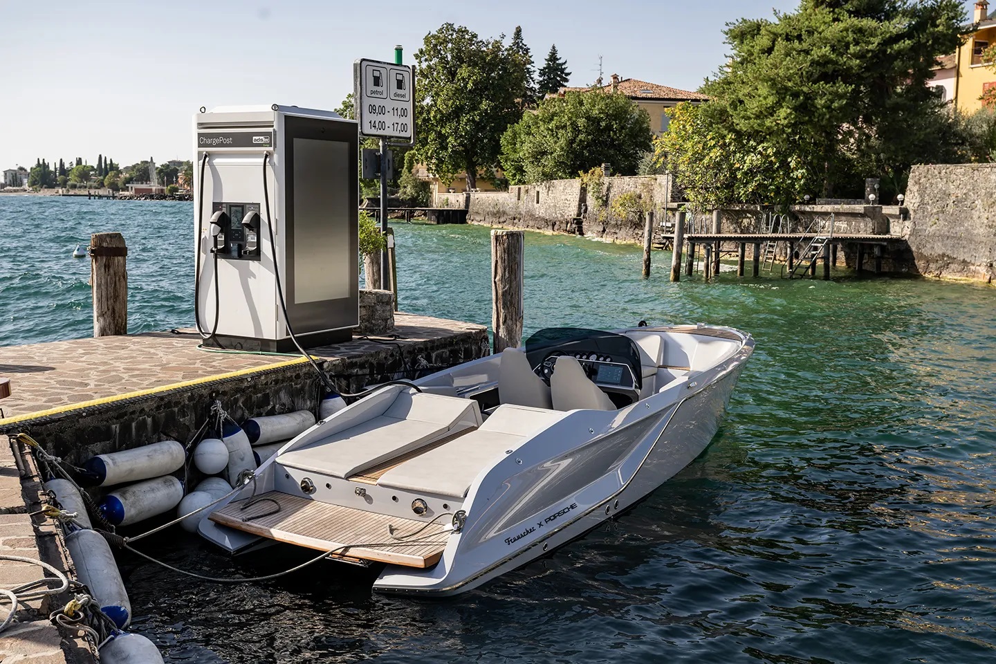 E-sport boat Frauscher × Porsche eFantom being charged with ChargePost from Ads-Tec Energy. The compact, all-in-one, ultra-fast charging system charges the eFantom in minutes instead of hours, with no need for grid expansion or construction. Photo: Ads-Tec Energy