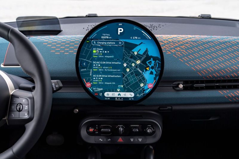 EV charging data plays a central role in the latest generation of electric MINIs, which feature a circular in-car OLED screen. Image Parkopedia