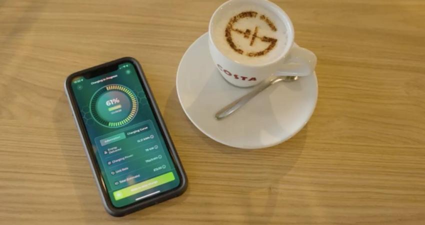 Gridserve app users can start, stop and monitor the real-time charging status of their vehicle with a few taps on their phone from the comfort of a nearby coffee shop. Photo: Gridserve