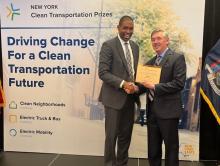 New York Lt. Governor Antonio Delgado (left) congratulates Volvo Group vice president Keith Brandis on the company receiving a $10 million award from NYSERDA