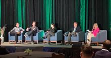 The panel discussion on accelerated EV adoption at EV Charging Infrastructure USA 2023. Seated, left to right, are Christopher Becker of Loop, Sebastian Street of Gridserve Sustainable Energy, Jane Hoffer of Daloop, Ed Munar of BorgWarner and the host Makenzie Lee