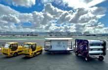 Universal Hydrogen’s recent operational demonstration at Hawthorne Airport in Los Angeles involved charging two DHL electrified tractors using a mobile AmpCart H2 prototype and portable hydrogen storage modules. Photo: Universal Hydrogen