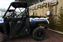 An all-electric Polaris Ranger XP Kinetic off-road vehicle charging at one of the four new off-road charging stations in Michigan's Upper Peninsula. Photo: Daniel Boczarski/Getty Images for Polaris